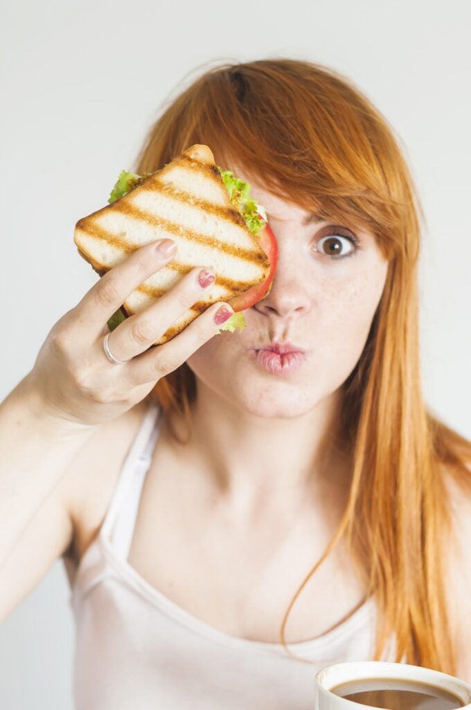 girl eating egg sandwich for weight loss